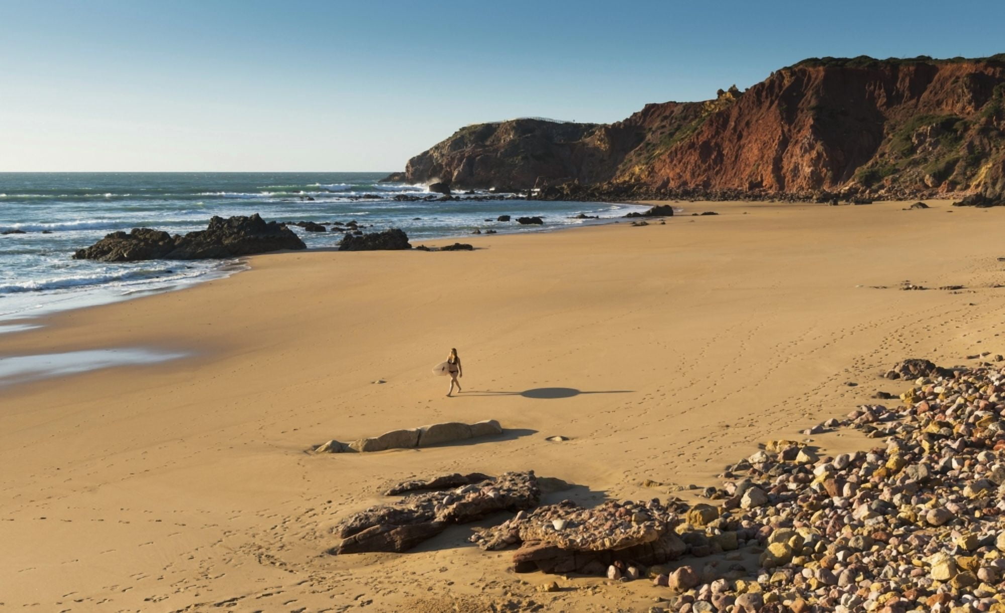 Portugal Algarve Distant View Of Surfer Walking On Playa Do Amado Carrapateira Canvas Art - Ben Welsh Design Pics (38 x 24)