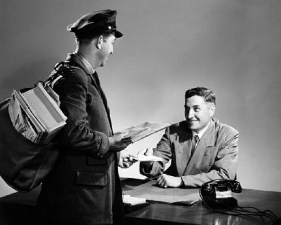 Postal worker delivering mail to a mid adult man sitting at a desk Canvas Art - (18 x 24)