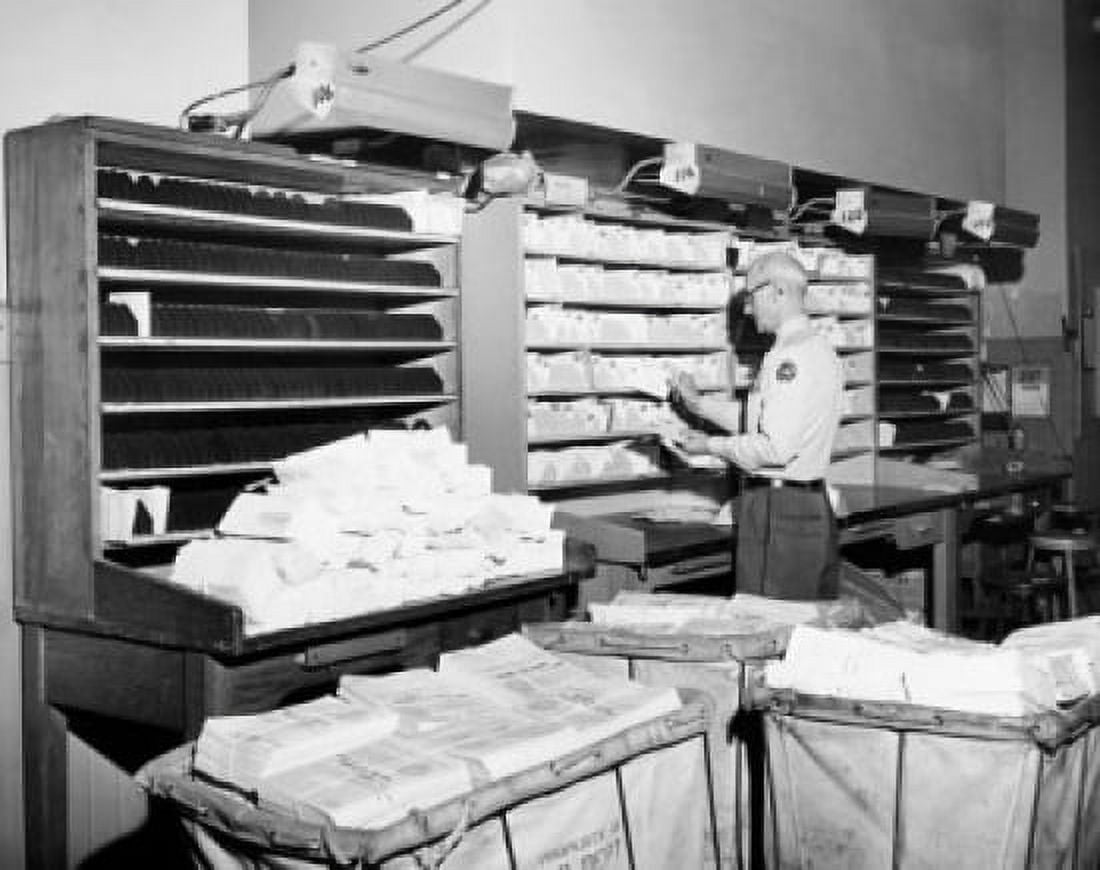 Postal worker sorting mail in a post office USA Canvas Art - (18 x 24)