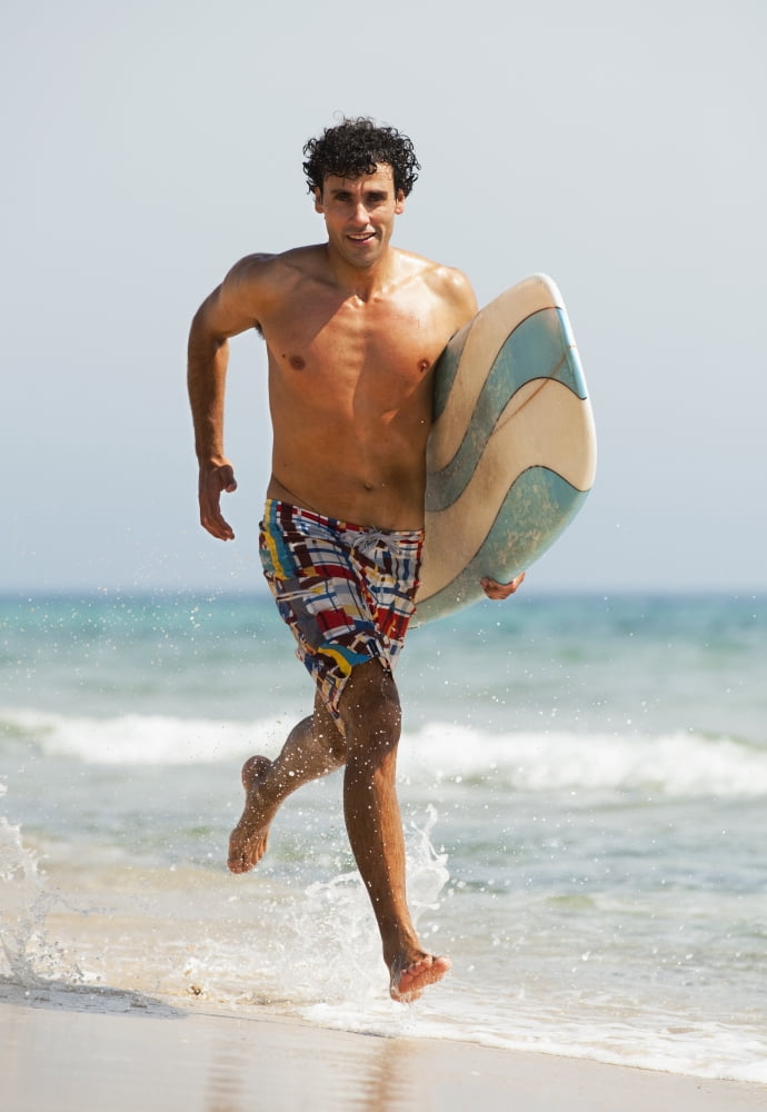 Posterazzi A Man Running Along Valdevaqueros Beach Carrying A Surf Board Tarifa Cadiz Andalusia Spain Canvas Art - Ben Welsh Design Pics (24 x 36)