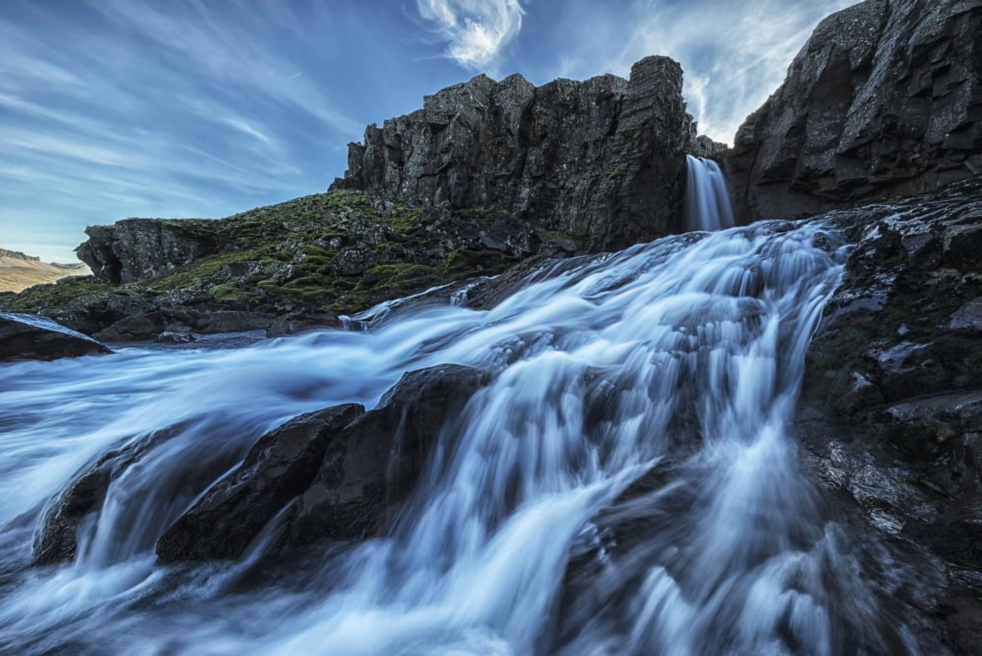 Posterazzi A small waterfall flows into the ocean along the eastern coast of Iceland Iceland Canvas Art - Robert Postma Design Pics (36 x 24)