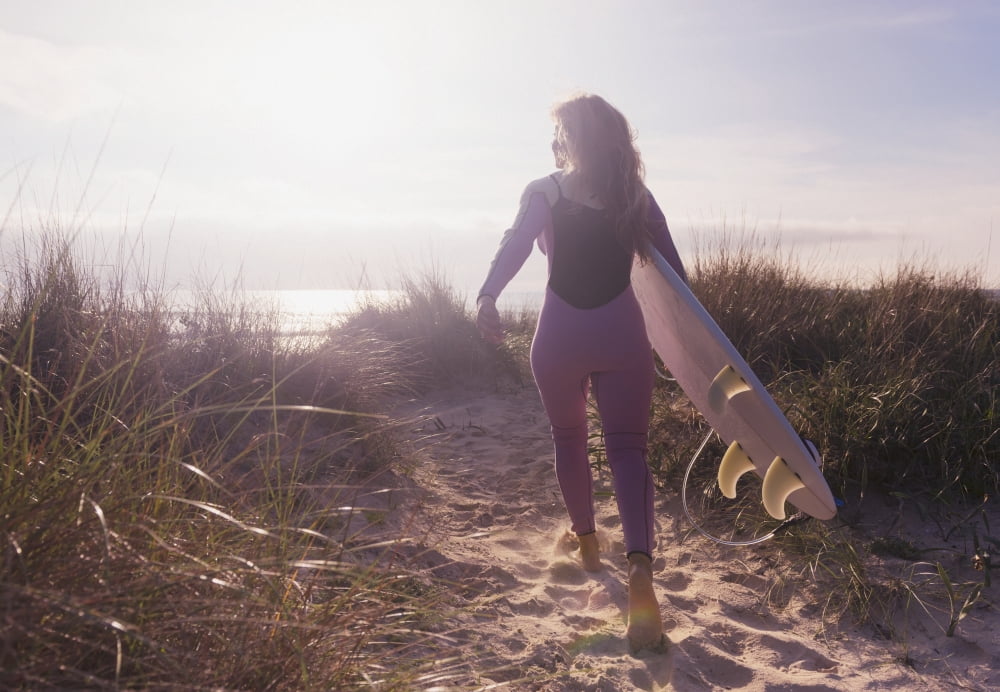 Posterazzi A woman carries her surfboard down a sandy path to the beachTarifa cadiz andaulsia spain Canvas Art - Ben Welsh Design Pics (36 x 24)