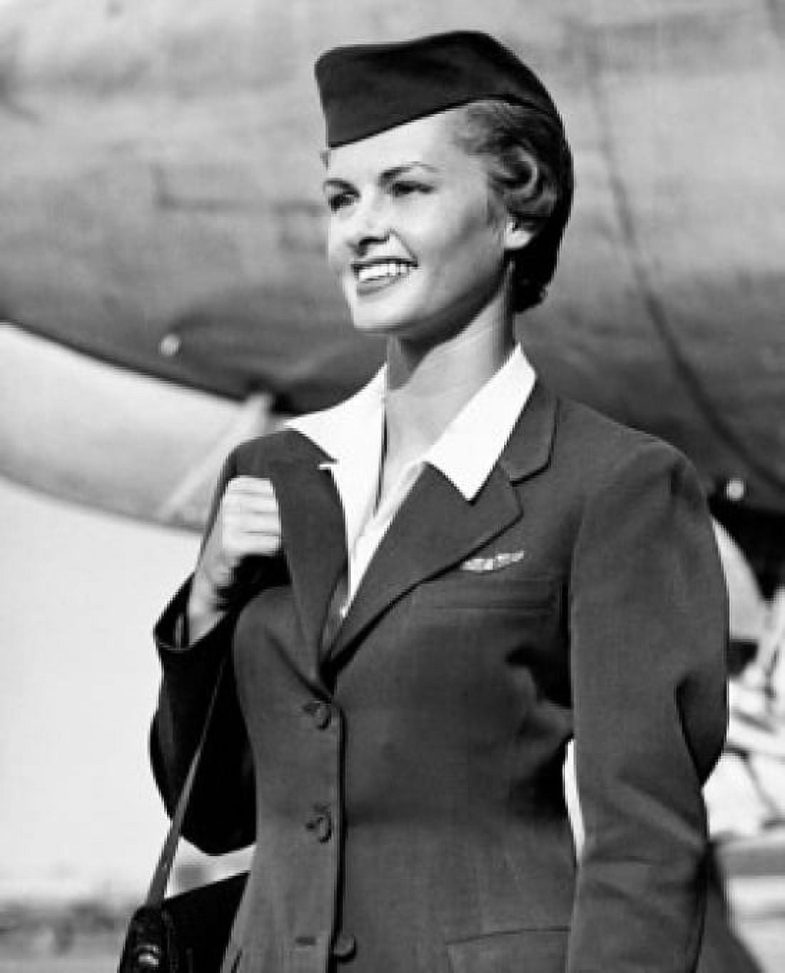 Posterazzi Air hostess carrying a bag and smiling Canvas Art - (24 x 36)