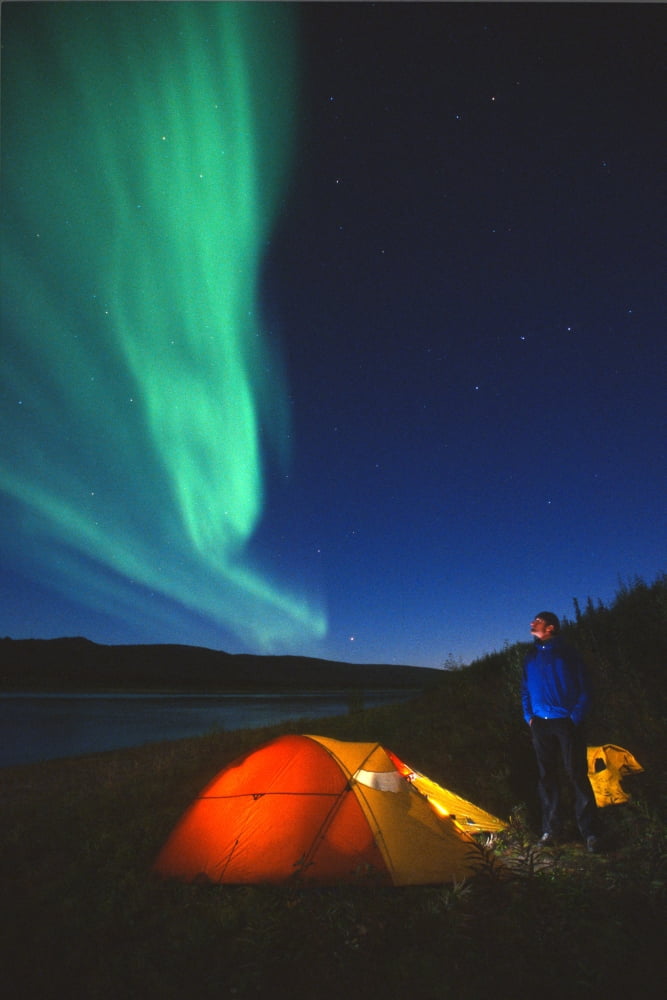 Posterazzi Aurora Borealis Above A Tent And Camper Along The Peel River Fort Macpherson Yukon Canvas Art - Peter Mather Design Pics (24 x 36)