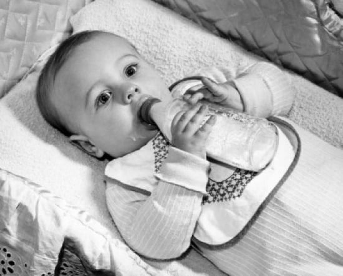 Posterazzi Baby drinking milk from baby bottle Canvas Art - (24 x 36)