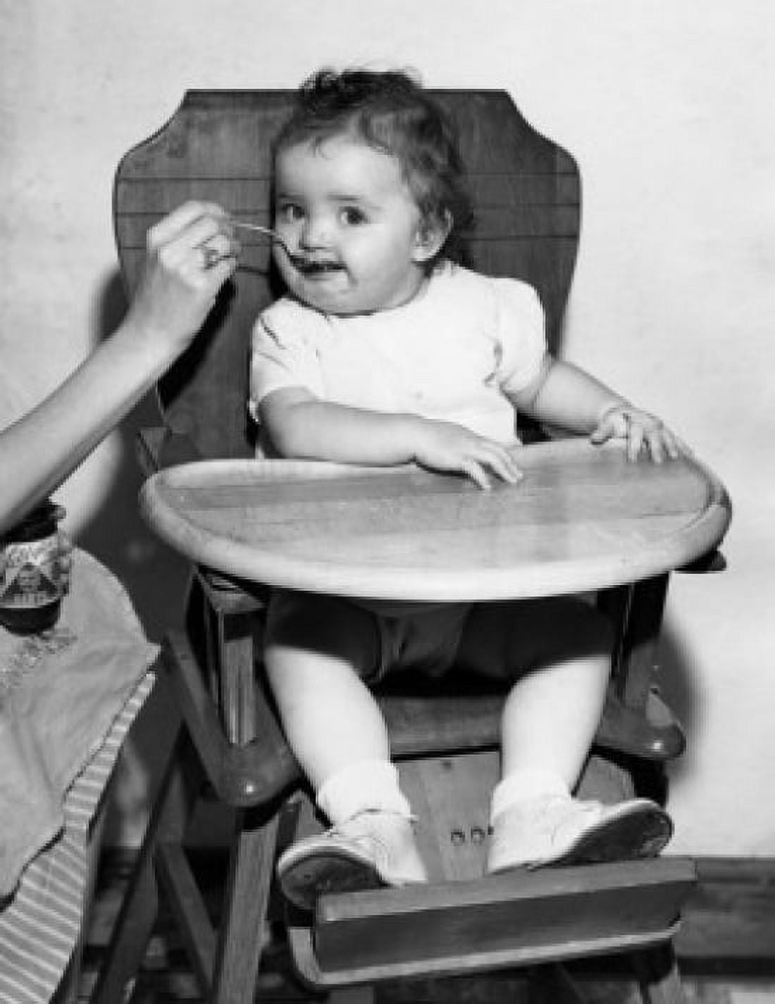Posterazzi Baby feeding in high chair Canvas Art -  (24 x 36)