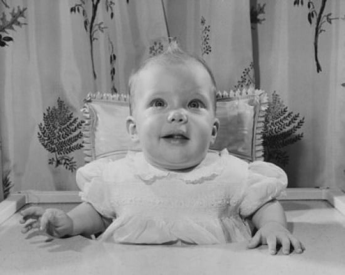 Posterazzi Baby girl sitting in a high chair Canvas Art - (24 x 36)