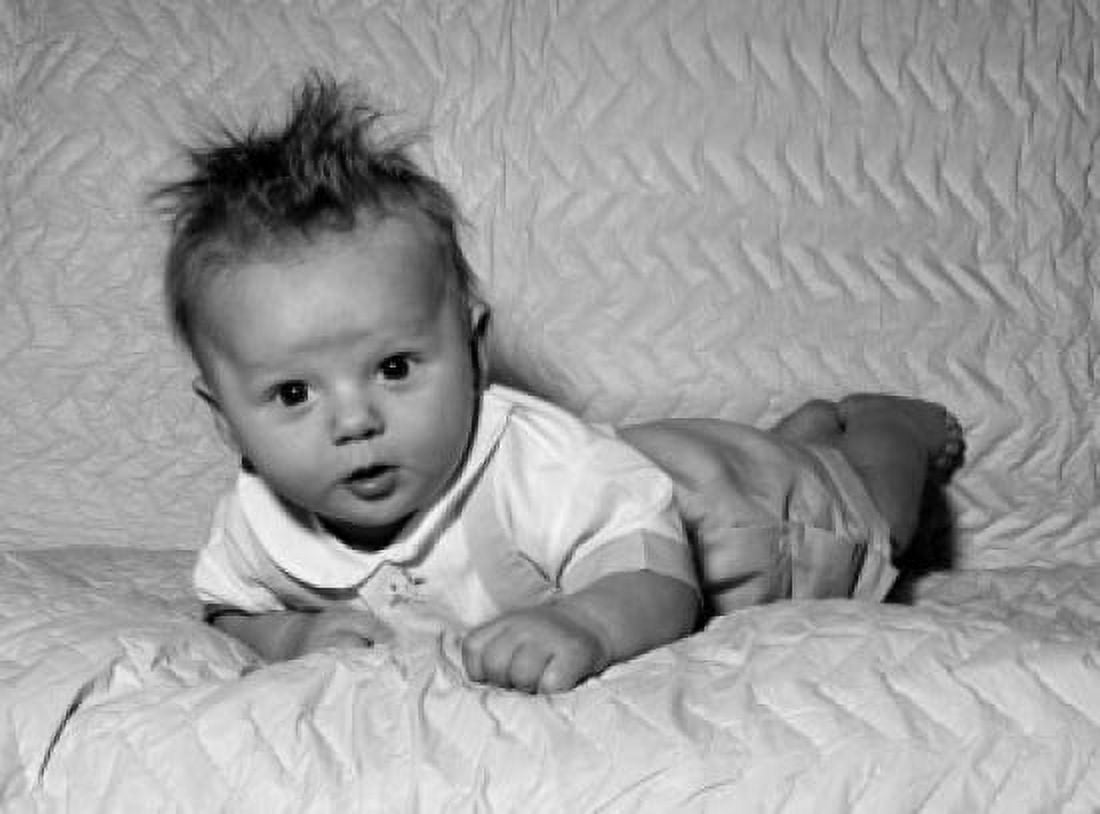 Posterazzi Baby laying on bed Canvas Art - (24 x 36)