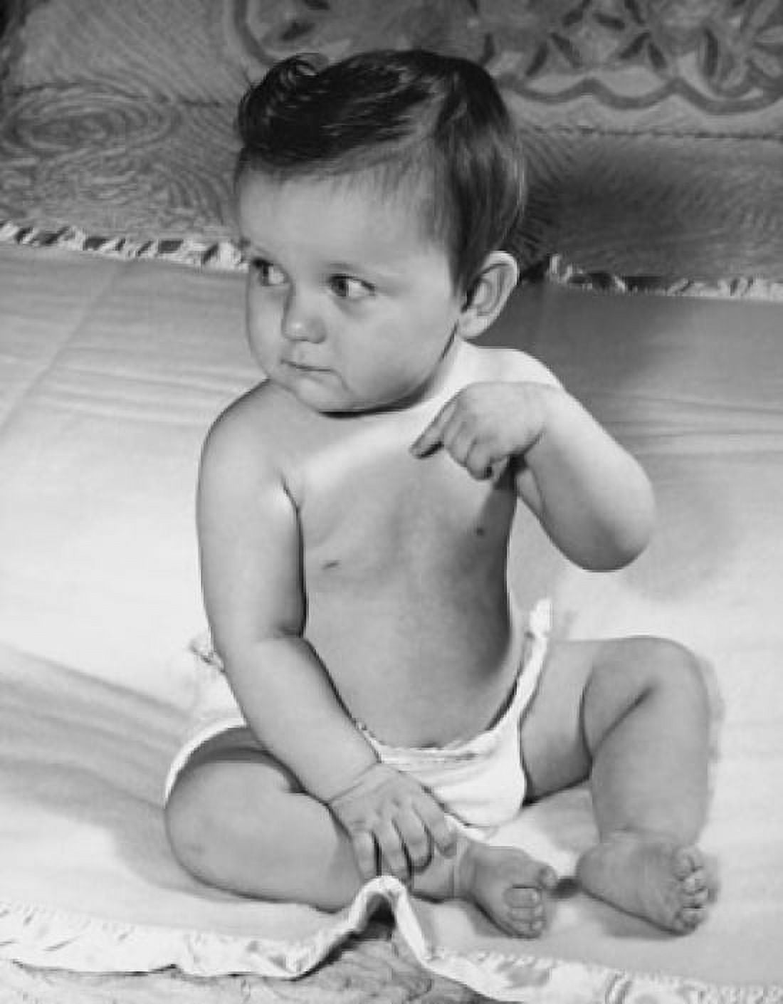 Posterazzi Baby sitting on the bed Canvas Art - (24 x 36)