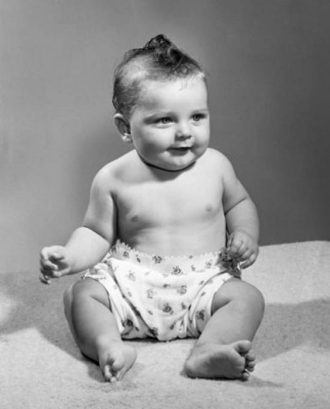Posterazzi Baby sitting on the bed Canvas Art - (24 x 36)