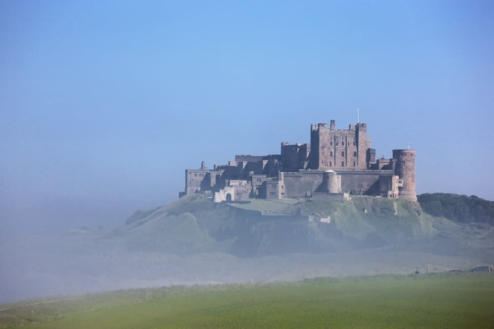 Posterazzi Bamburgh Castle In The Fog Bamburgh Northumberland England Canvas Art - John Short Design Pics (38 x 24)