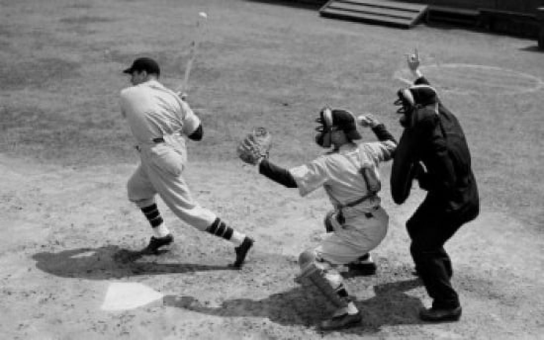 Posterazzi Baseball player swinging a baseball bat with a baseball catcher and a baseball umpire standing beside him Canvas Art -  (24 x 36)