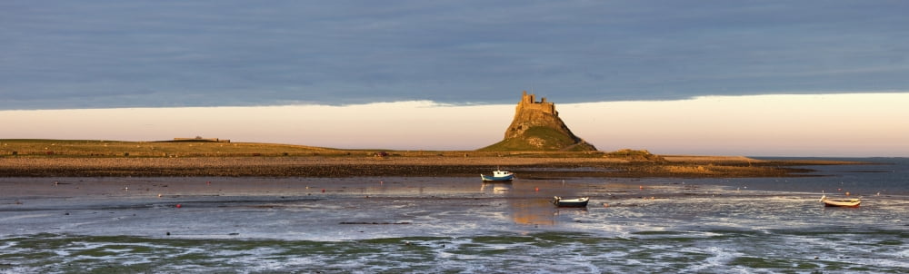 Posterazzi Boats In The Water And A Castle On The Tidal Island Also Known As Holy Island Lindisfarne Northumberland England Canvas Art - John Short Design Pics (44 x 14)