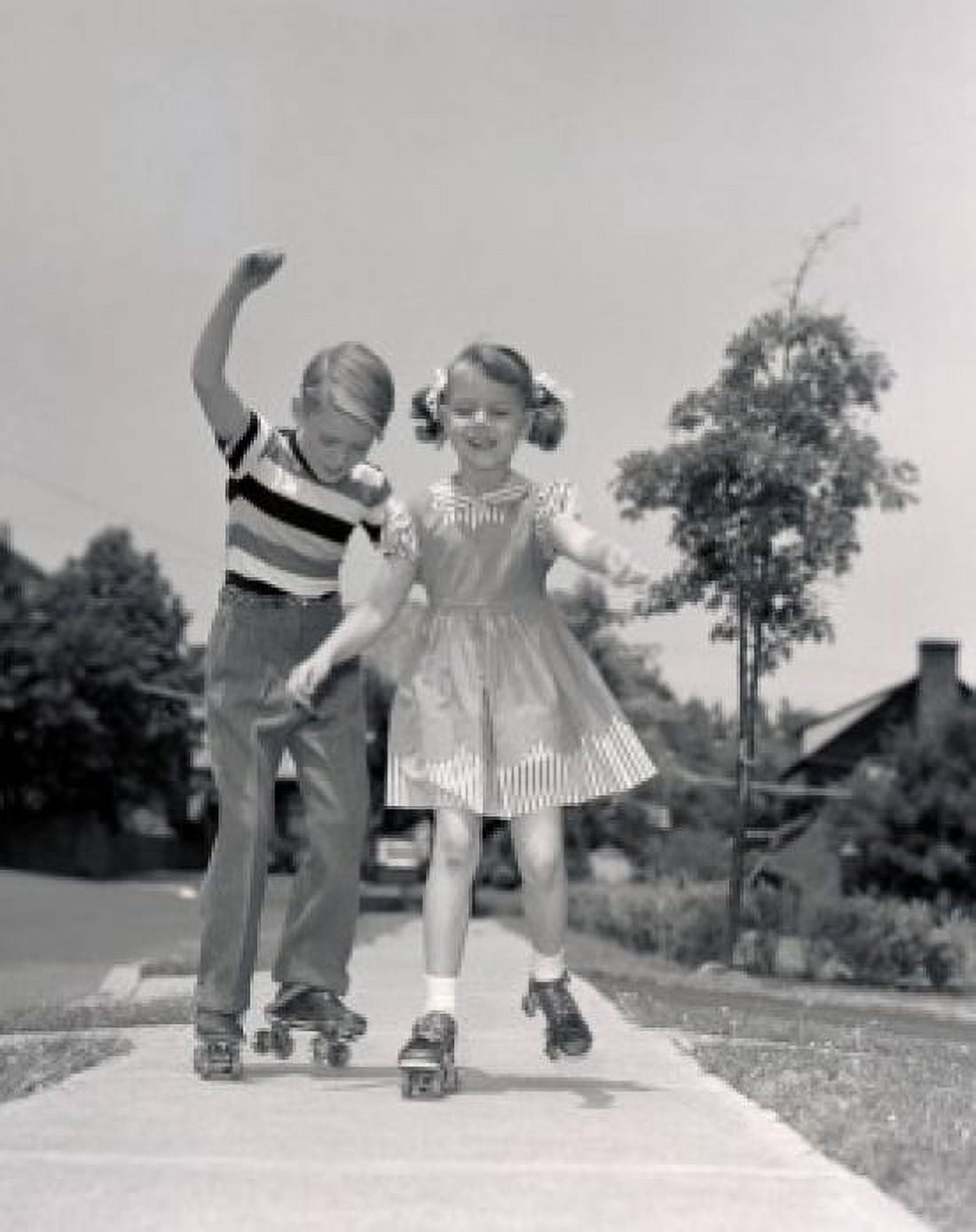 Posterazzi Boy and girl roller-skating Canvas Art - (24 x 36)