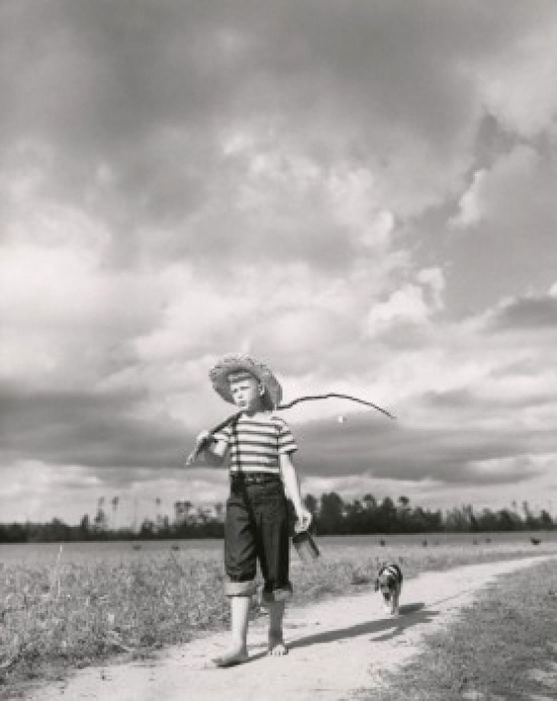 Posterazzi Boy carrying a fishing rod on his shoulder Canvas Art -  (24 x 36)