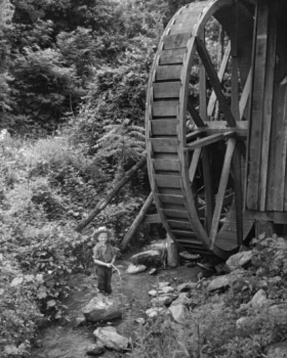 Posterazzi Boy fishing in a stream near a water wheel North Carolina USA Canvas Art - (24 x 36)