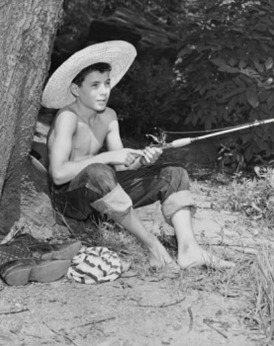Posterazzi Boy holding a fishing rod Canvas Art -  (24 x 36)