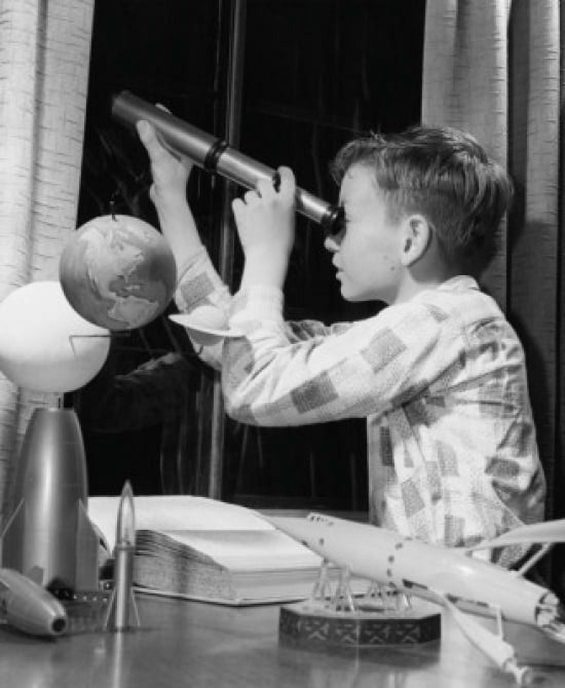 Posterazzi Boy looking through a telescope Canvas Art - (24 x 36)