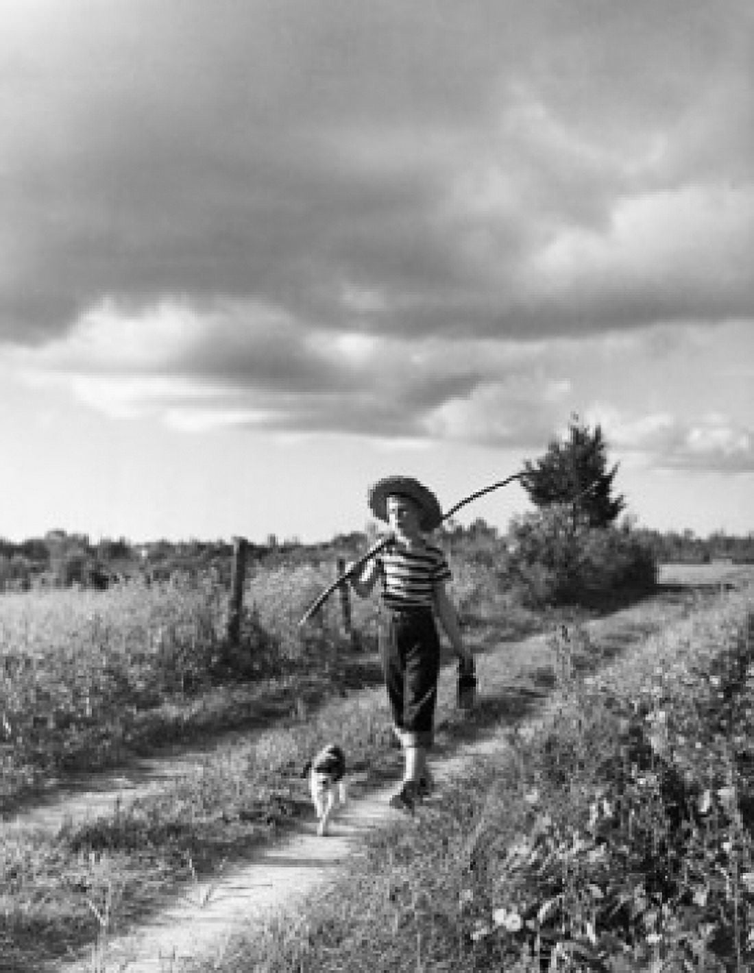 Posterazzi Boy walking with dog and carrying stick Canvas Art -  (24 x 36)