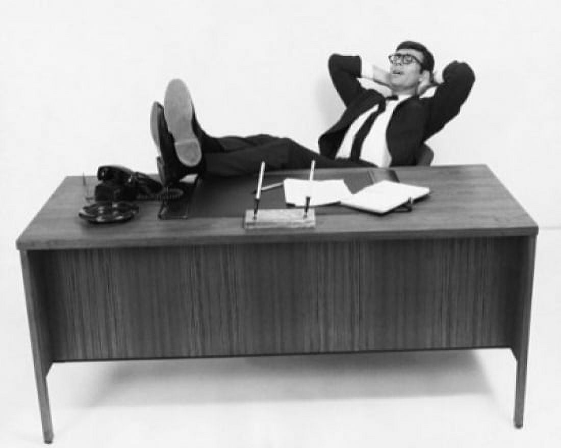Posterazzi Businessman resting in an office with his feet up Canvas Art - (24 x 36)