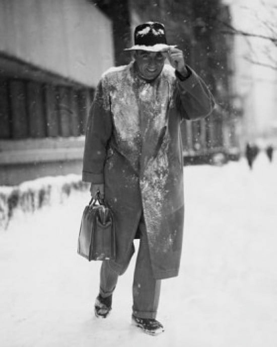 Posterazzi Businessman walking on a snow covered road Canvas Art - (24 x 36)