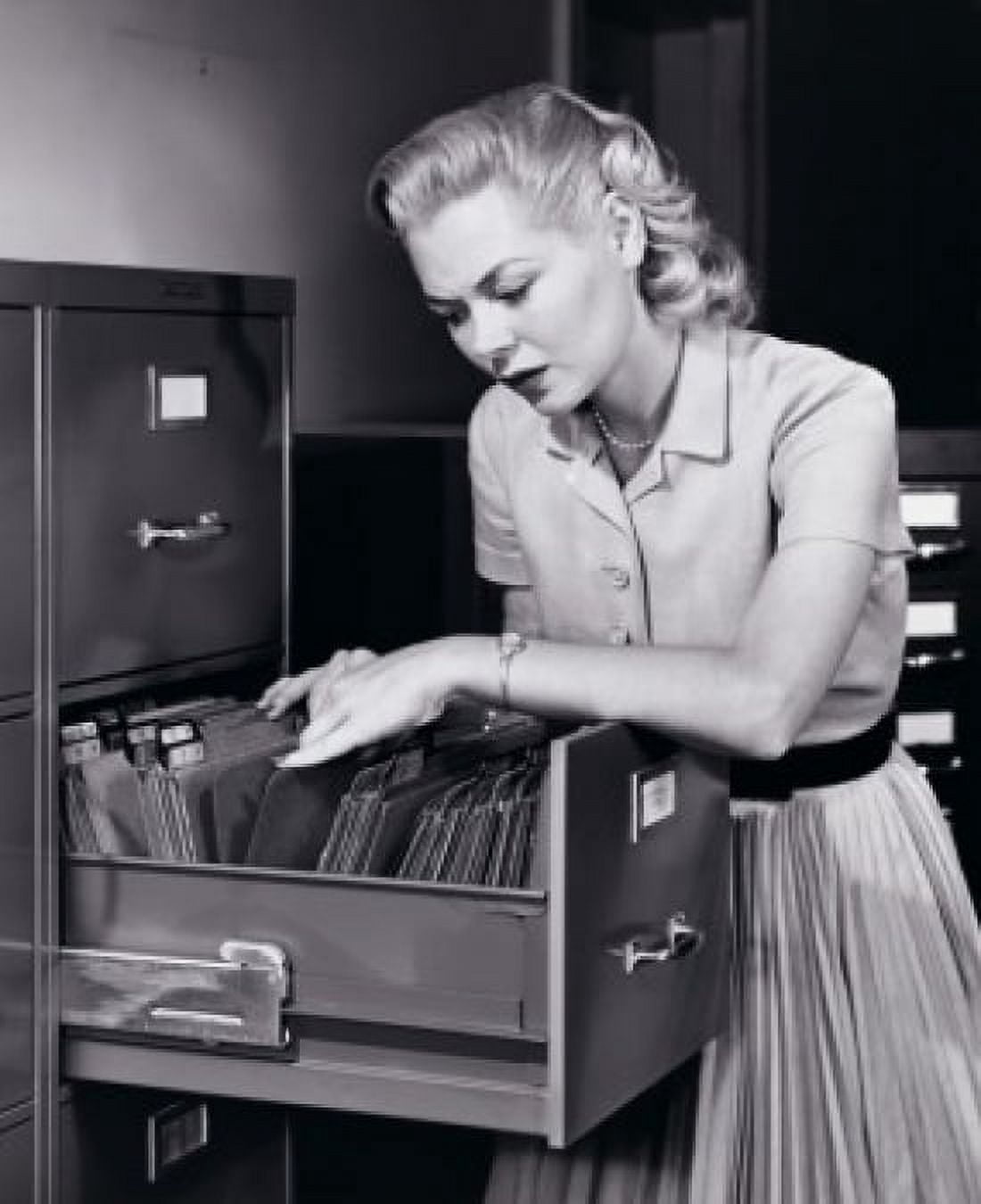 Posterazzi Businesswoman searching for files in a filing cabinet Canvas Art - (24 x 36)