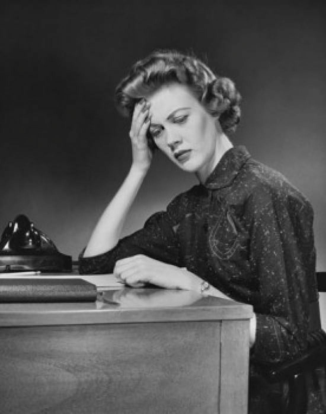 Posterazzi Businesswoman sitting at a desk in an office Canvas Art - (24 x 36)