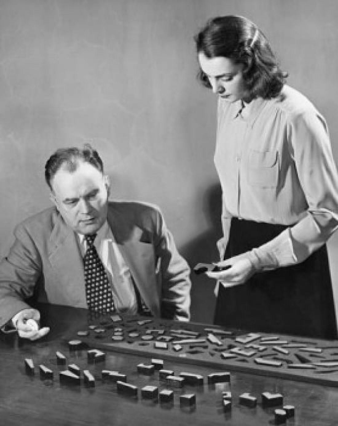 Posterazzi Businesswoman undergoing an aptitude test with a businessman sitting beside her Canvas Art - (24 x 36)