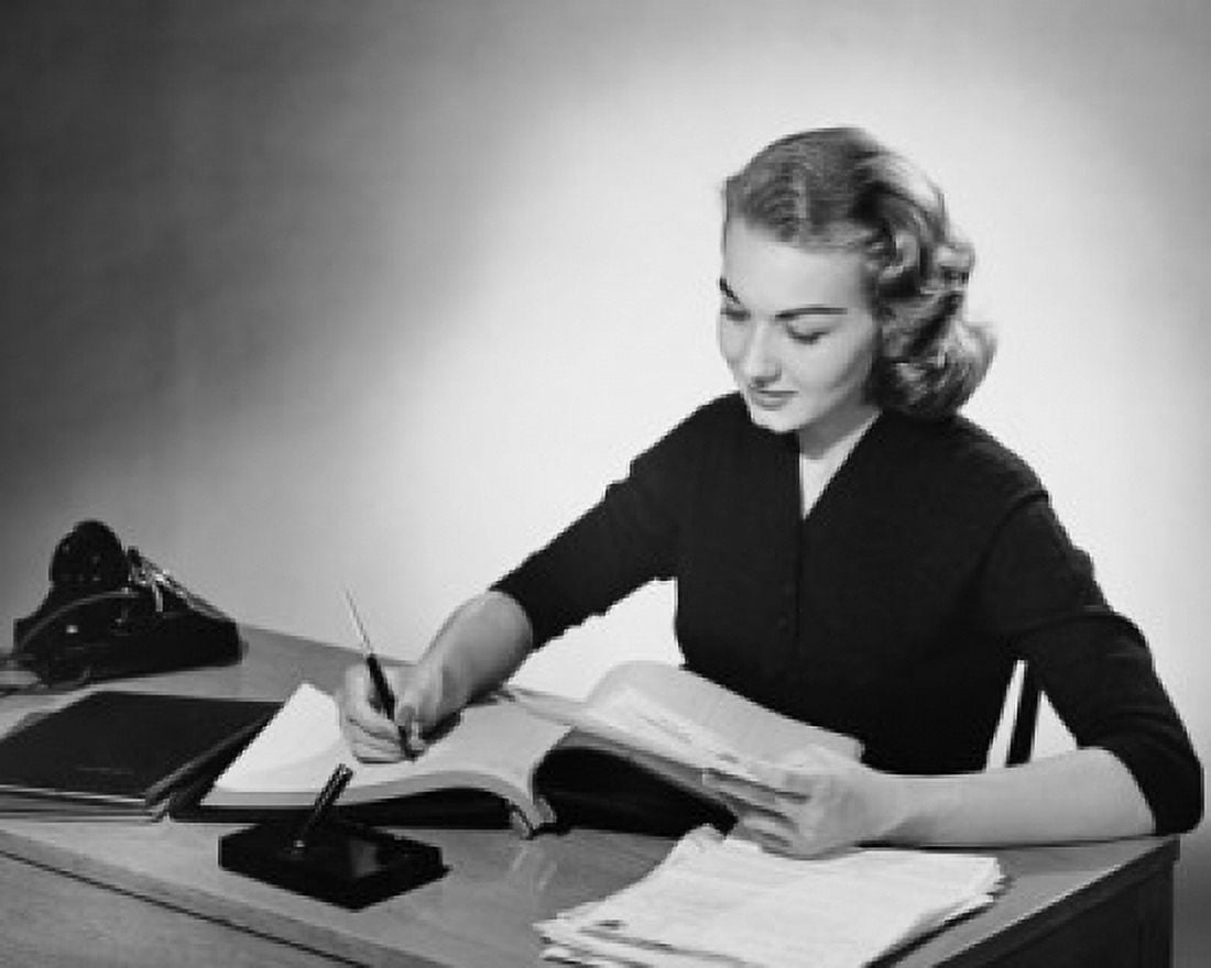 Posterazzi Businesswoman writing in a notebook with a pen in an office Canvas Art - (24 x 36)