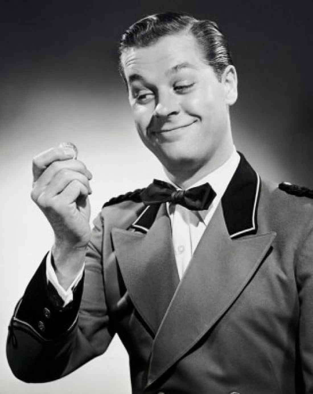Posterazzi Close-up of a bellhop smiling and holding a coin Canvas Art - (24 x 36)