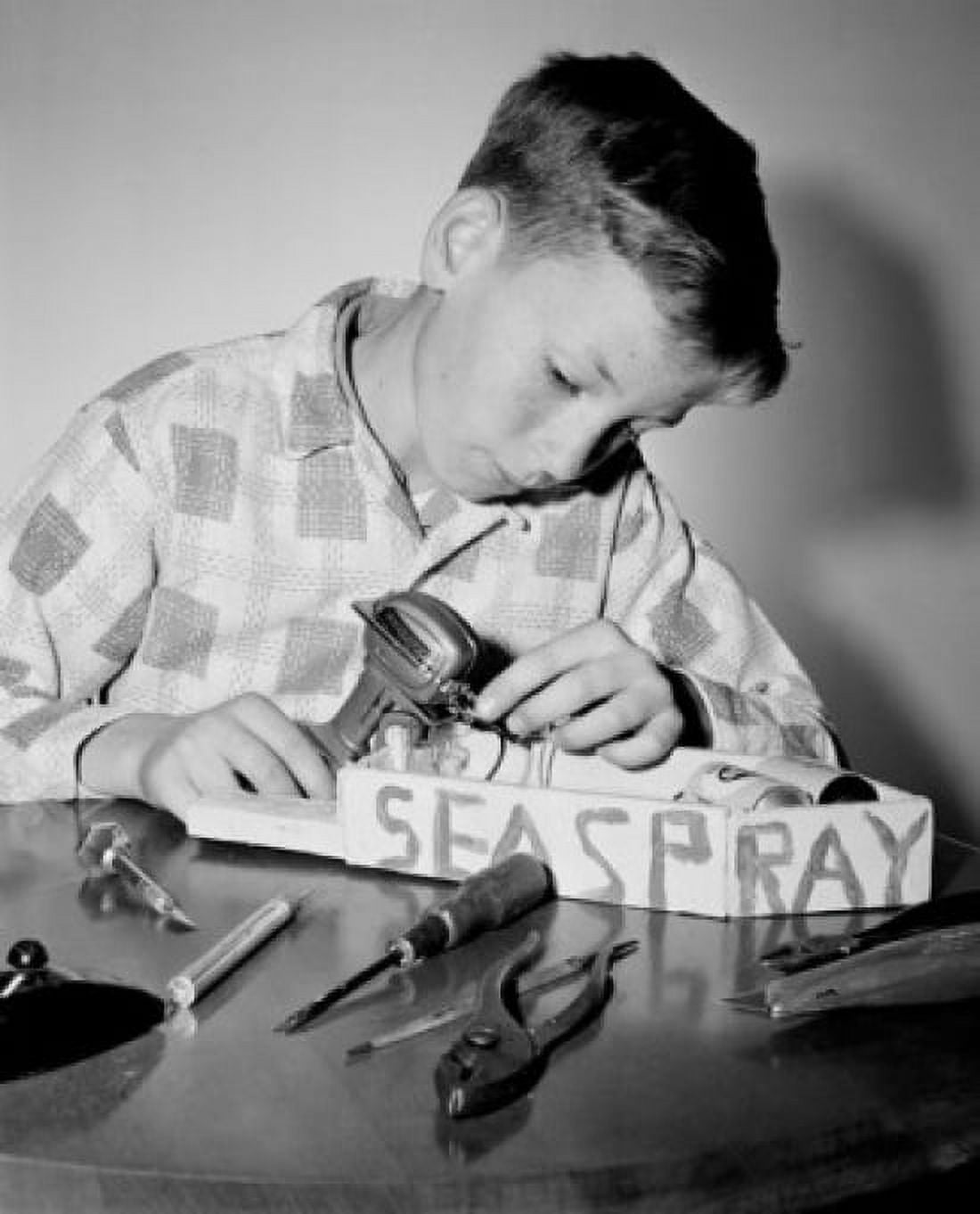 Posterazzi Close-up of a boy building a model boat Canvas Art - (24 x 36)