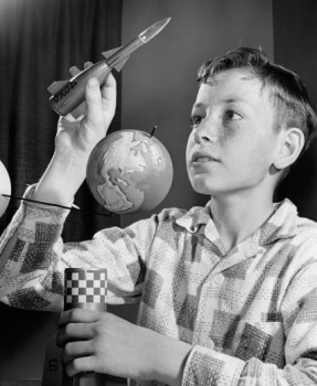 Posterazzi Close-up of a boy holding a model of a rocket Canvas Art - (24 x 36)