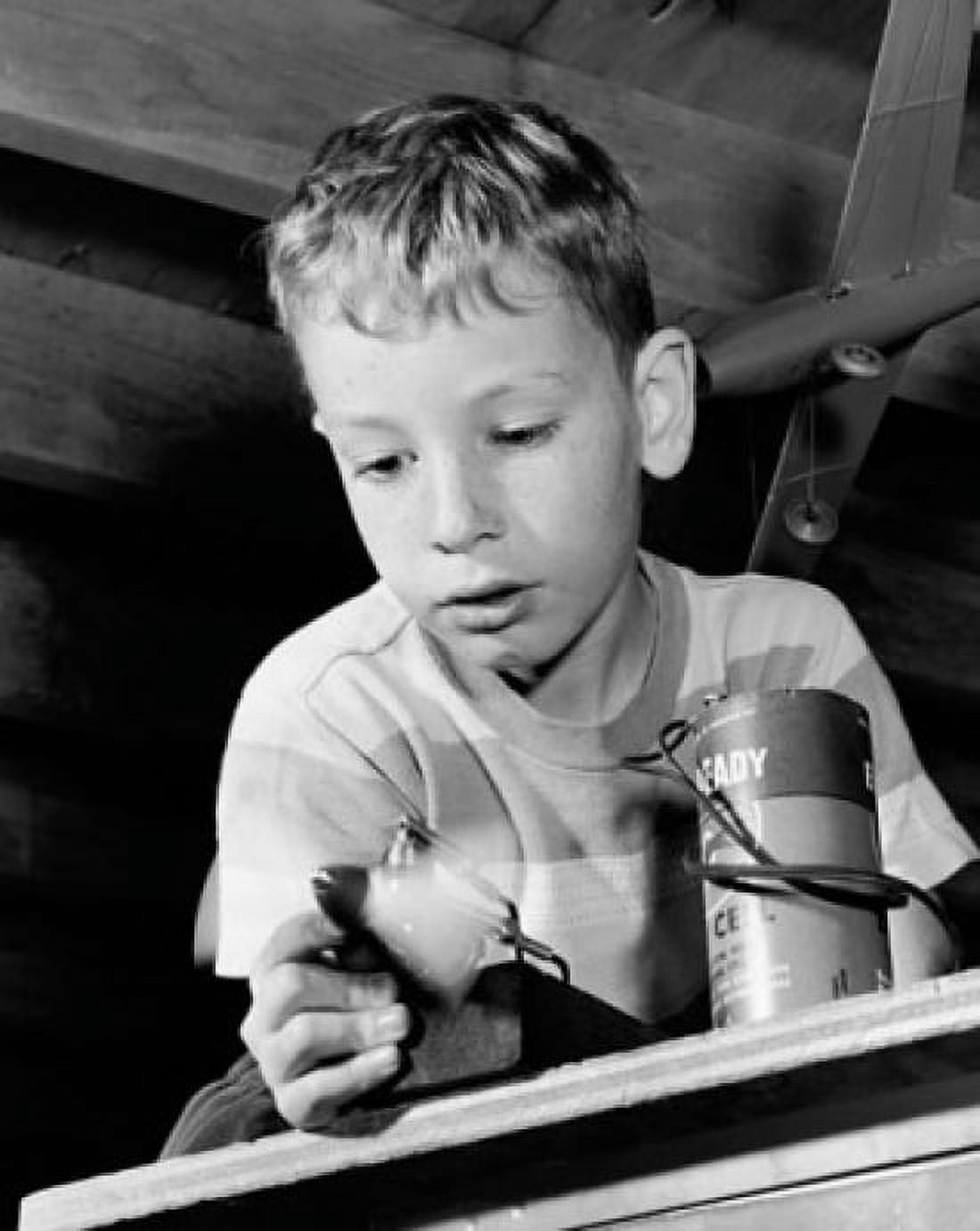 Posterazzi Close-up of a boy playing with a model airplane Canvas Art - (24 x 36)