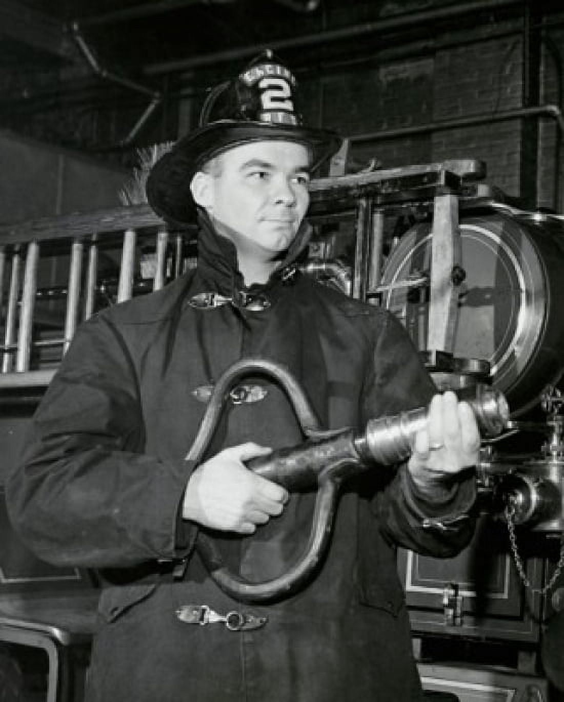 Posterazzi Close-up of a firefighter holding a fire hose Canvas Art - (24 x 36)