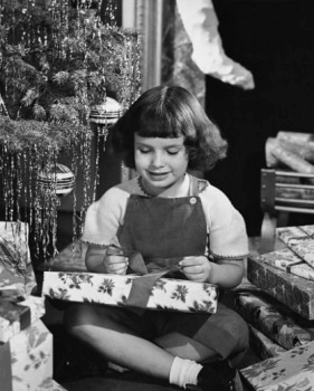 Posterazzi Close-up of a girl opening a Christmas present Canvas Art - (24 x 36)