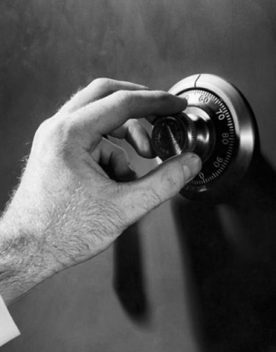 Posterazzi Close-up of a mans hand turning a safe dial Canvas Art - (24 x 36)