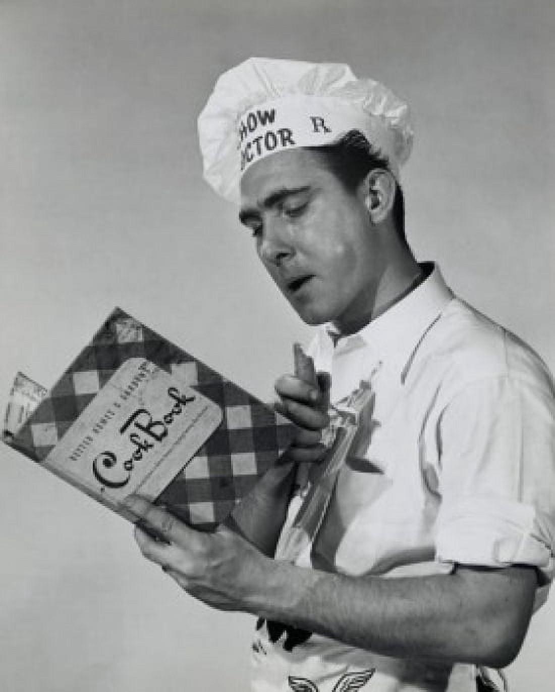 Posterazzi Close-up of a mid adult man reading a cookbook Canvas Art - (24 x 36)