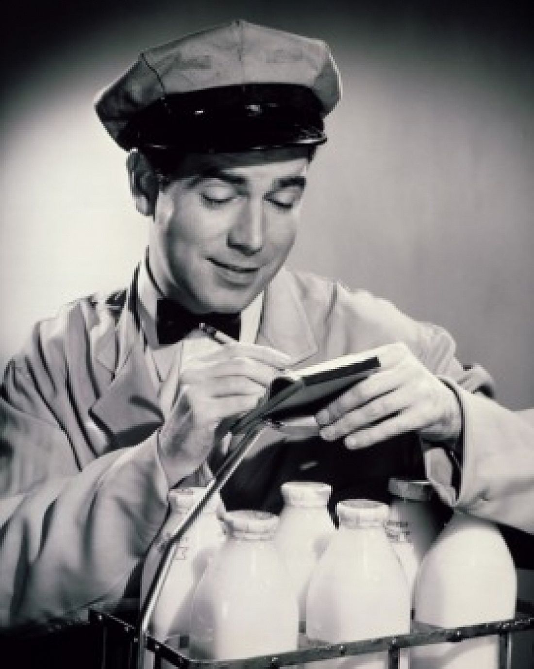 Posterazzi Close-up of a milkman writing on a note pad Canvas Art - (24 x 36)