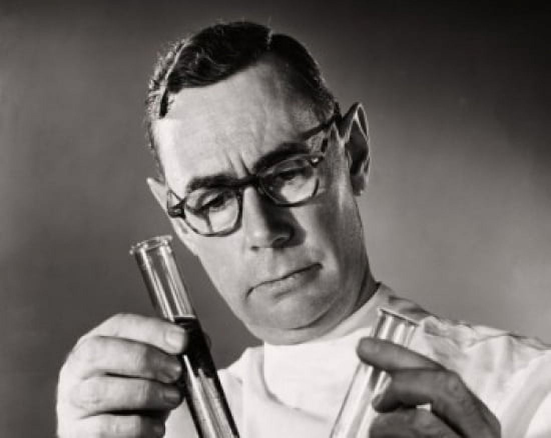 Posterazzi Close-up of a scientist comparing chemicals in two test tubes Canvas Art - (24 x 36)