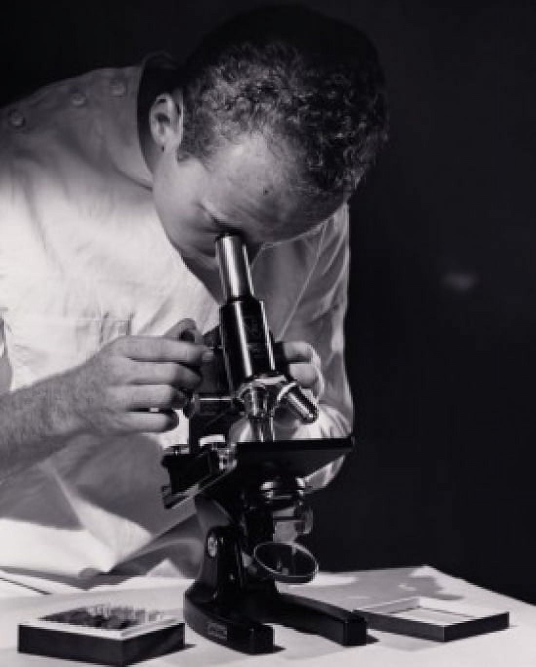 Posterazzi Close-up of a scientist looking through a microscope Canvas Art - (24 x 36)