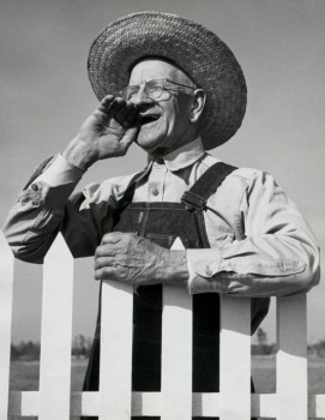 Posterazzi Close-up of a senior man standing near a picket fence Canvas Art - (24 x 36)