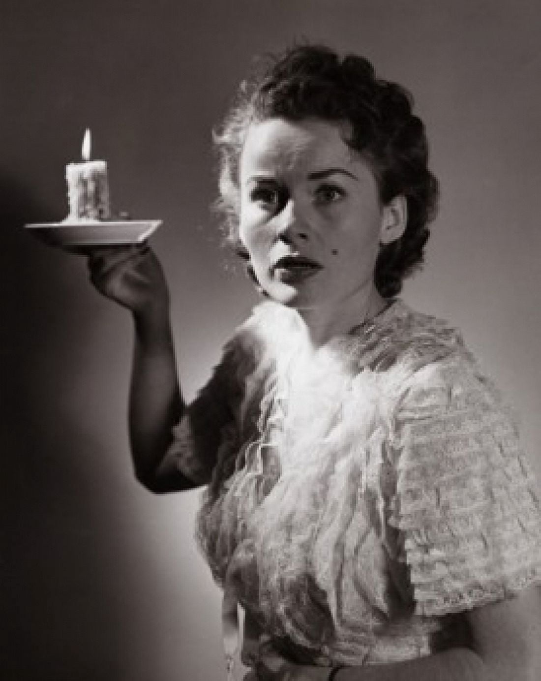 Posterazzi Close-up of a woman holding a candle Canvas Art - (24 x 36)