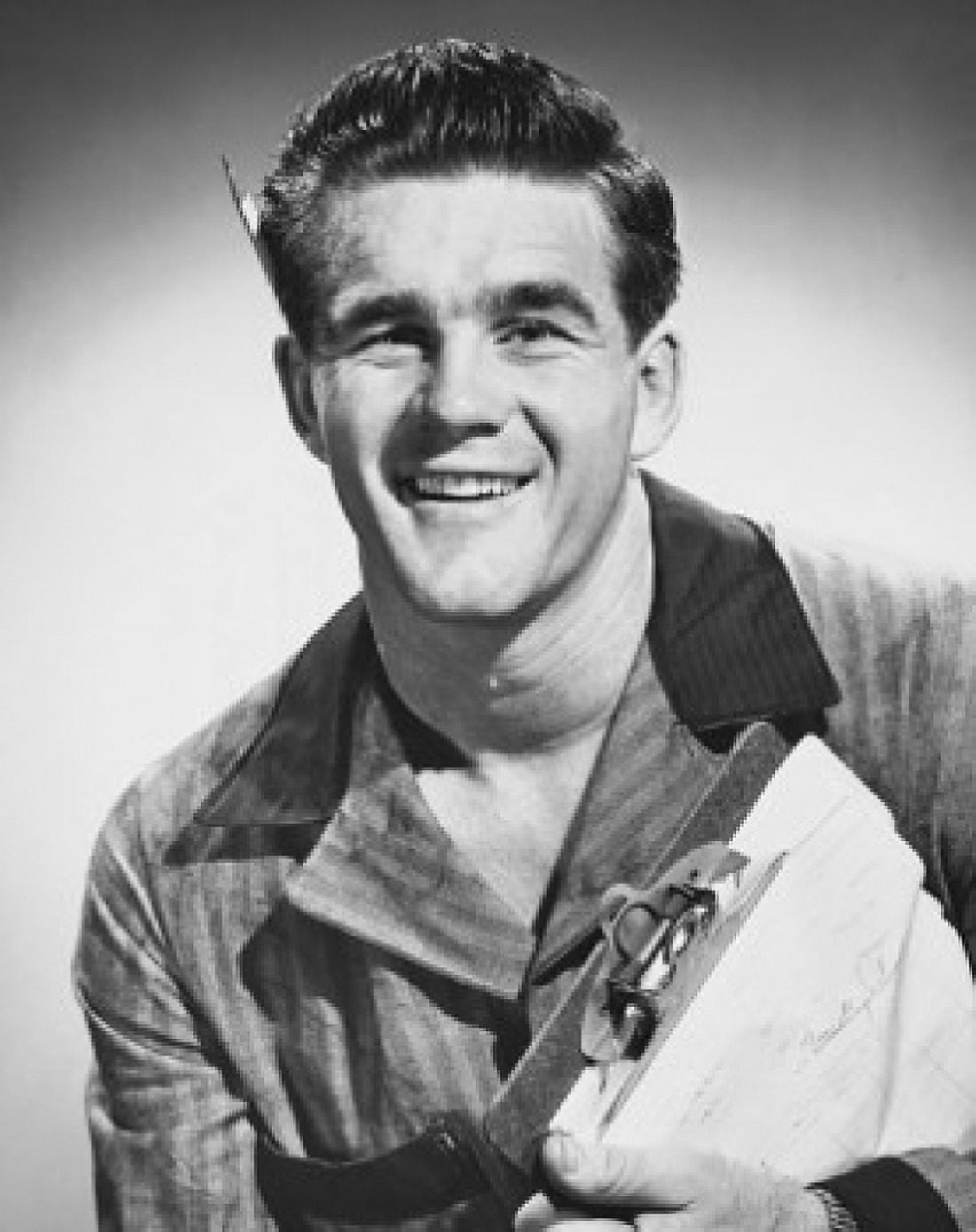 Posterazzi Close-up of a young man smiling and holding a clipboard Canvas Art -  (24 x 36)