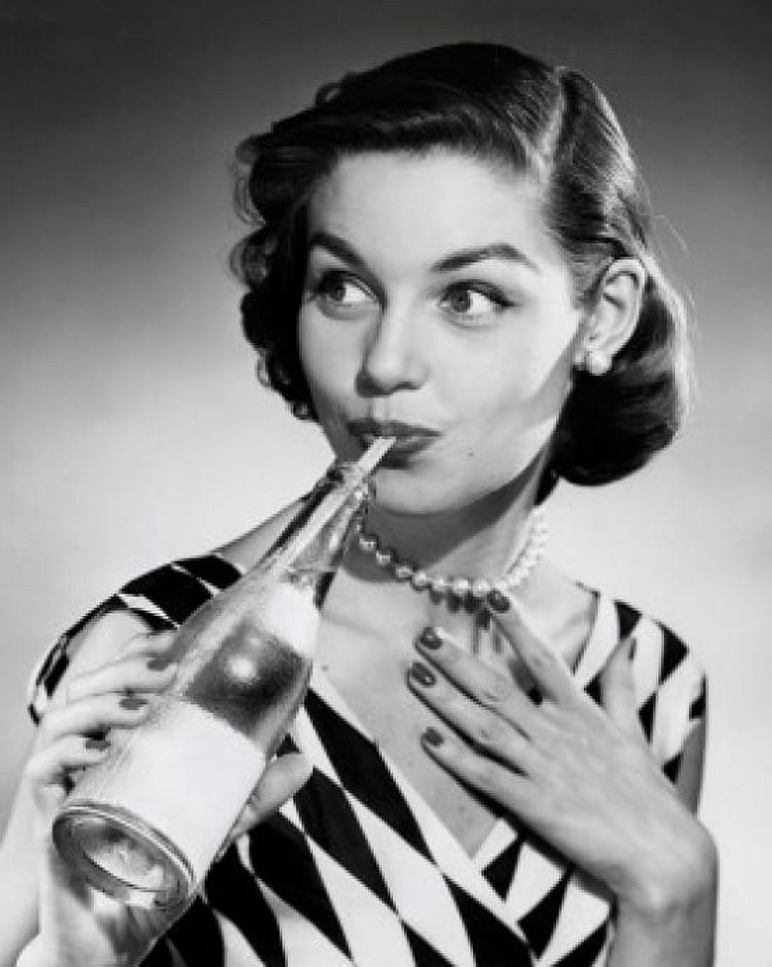 Posterazzi Close-up of a young woman drinking from soda bottle with a drinking straw Canvas Art -  (24 x 36)