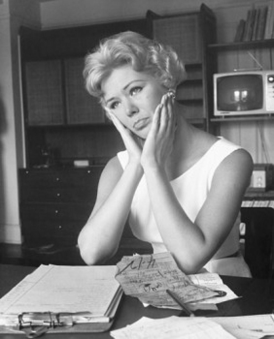 Posterazzi Close-up of a young woman sitting at a table and looking worried Canvas Art - (24 x 36)