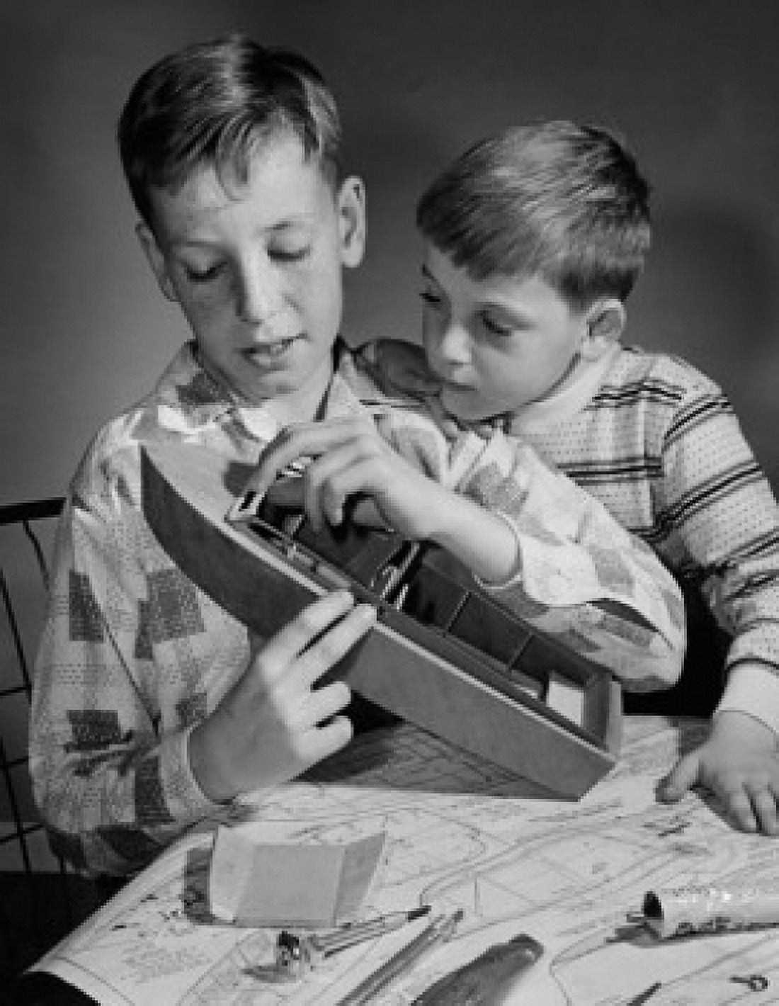 Posterazzi Close-up of two boys building a model Canvas Art - (24 x 36)