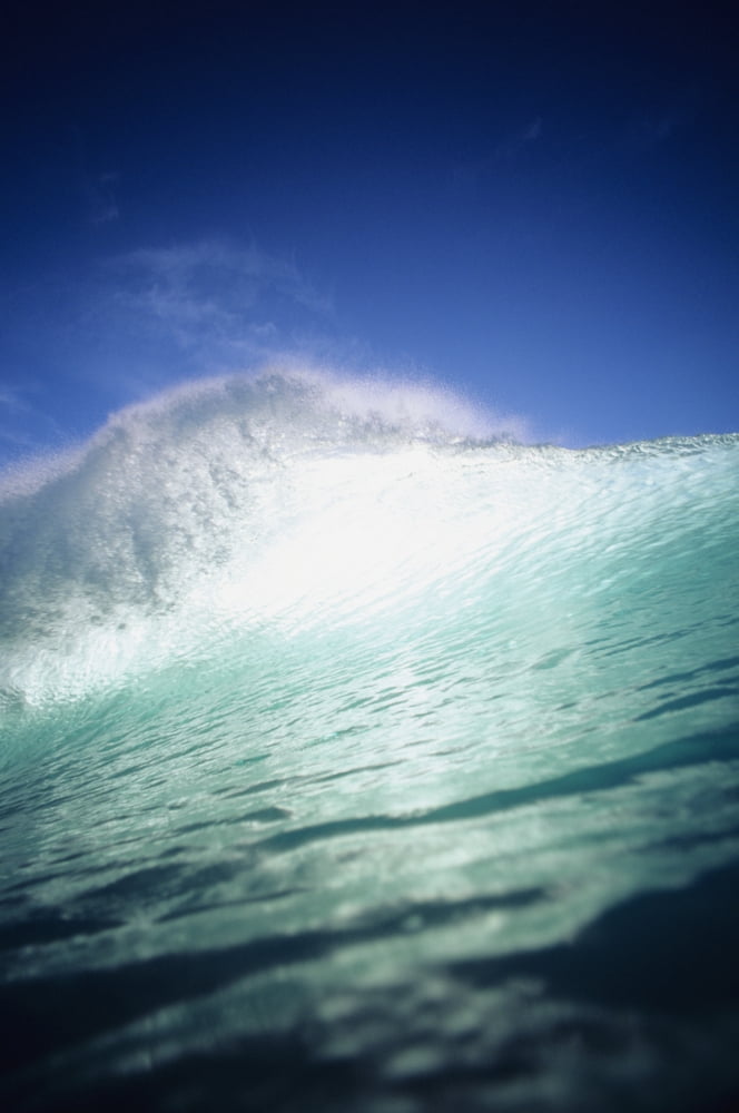 Posterazzi Closeup angle of green wave with backlit crest bright blue sky Canvas Art - Vince Cavataio Design Pics (22 x 34)