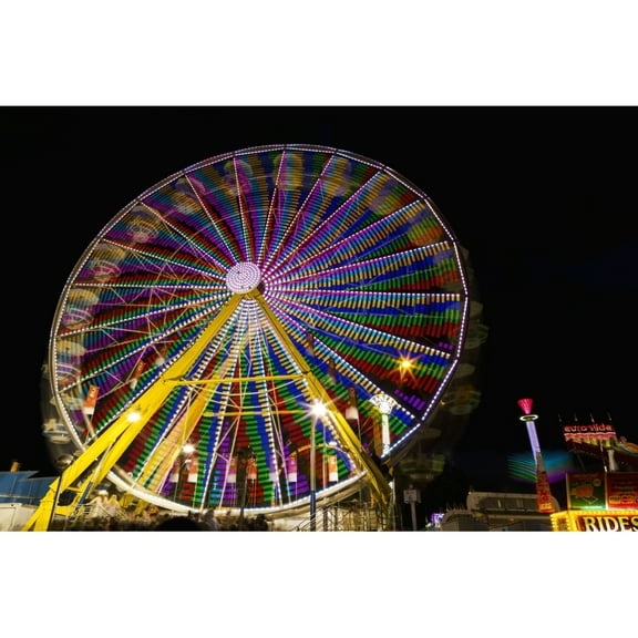Posterazzi DPI12285197 Colourful Lights of A Moving Ferris Wheel At Nighttime - Calgary Alberta Canada Poster Print by Michael Interisano, 19 x 12