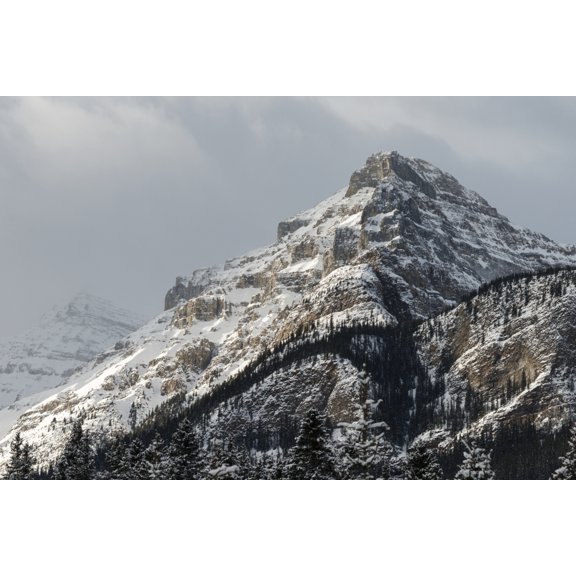 Posterazzi DPI12285064 Rugged Mountain Peak with Snow Under A Cloudy Sky - Lake Louise Alberta Canada Poster Print by Keith Levit, 19 x 12