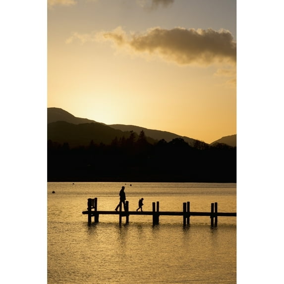 Posterazzi DPI12290321 Silhouette of A Parent & Child Walking On A Dock On A Tranquil Lake At Sunset - South Lakeland District England Poster Print by John Short, 12 x 19